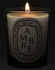Diptyque Ambre (Amber) Candle - lit candle shown