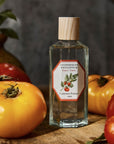 Lifestyle shot of Carriere Freres Tomato Room Spray (200 ml) with tomatoes in the foreground and background