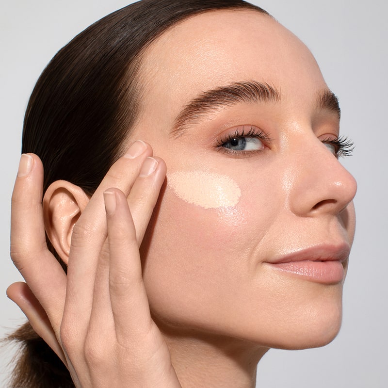 Odacite SPF 50 Flex-Perfecting™ Mineral Drops Tinted Sunscreen - Model shown applying product