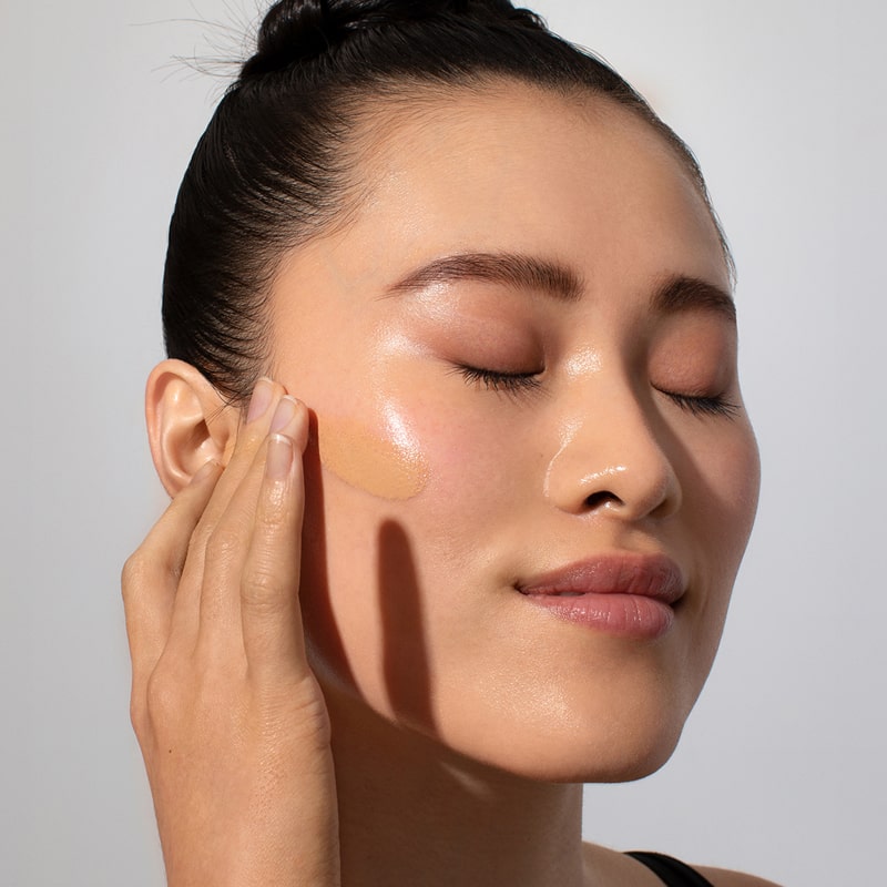 Odacite SPF 50 Flex-Perfecting™ Mineral Drops Tinted Sunscreen - TWO - Model shown applying product to face