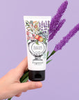Absolute Balm - Lavender - Hand holding product with lavender in the background