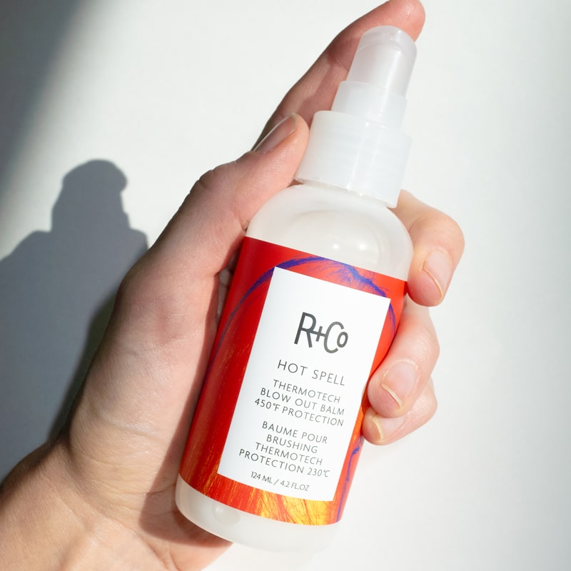 R+Co Hot Spell Thermotech Blowout Balm - Product shown in models hand