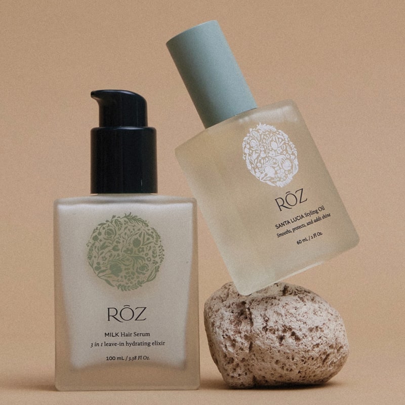 Roz The Sleek &amp; Smooth Duo - serum and oil lifestyle shot with rock
