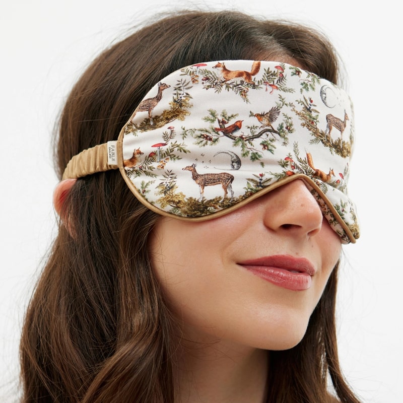 Fable England A Night's Tale - Crystal Grey Woodland Scene Sleep Mask - Model shown with product covering eyes