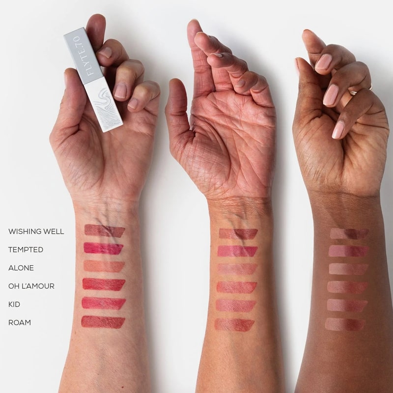 Flyte.70 S+S.LipSheer Tinted Lipstick Balm showing all colors on models&#39; arms of different skin tones.