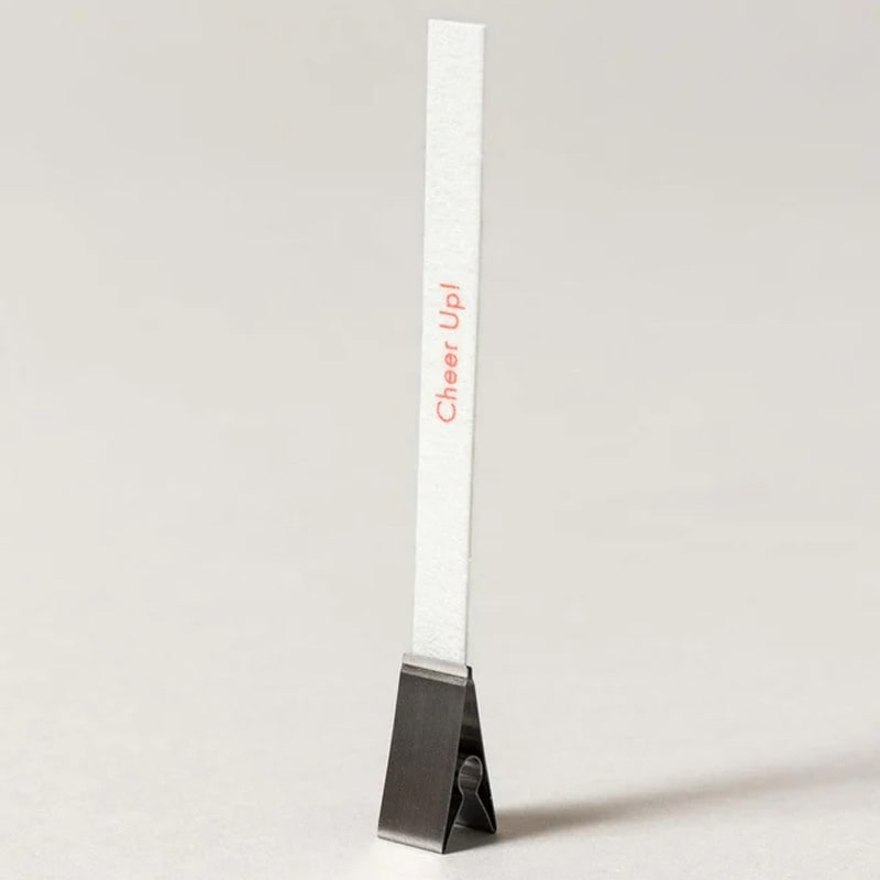 Kunjudo Washi Paper Incense Strips - Smoky Comfort - photo of incense paper in metal clip