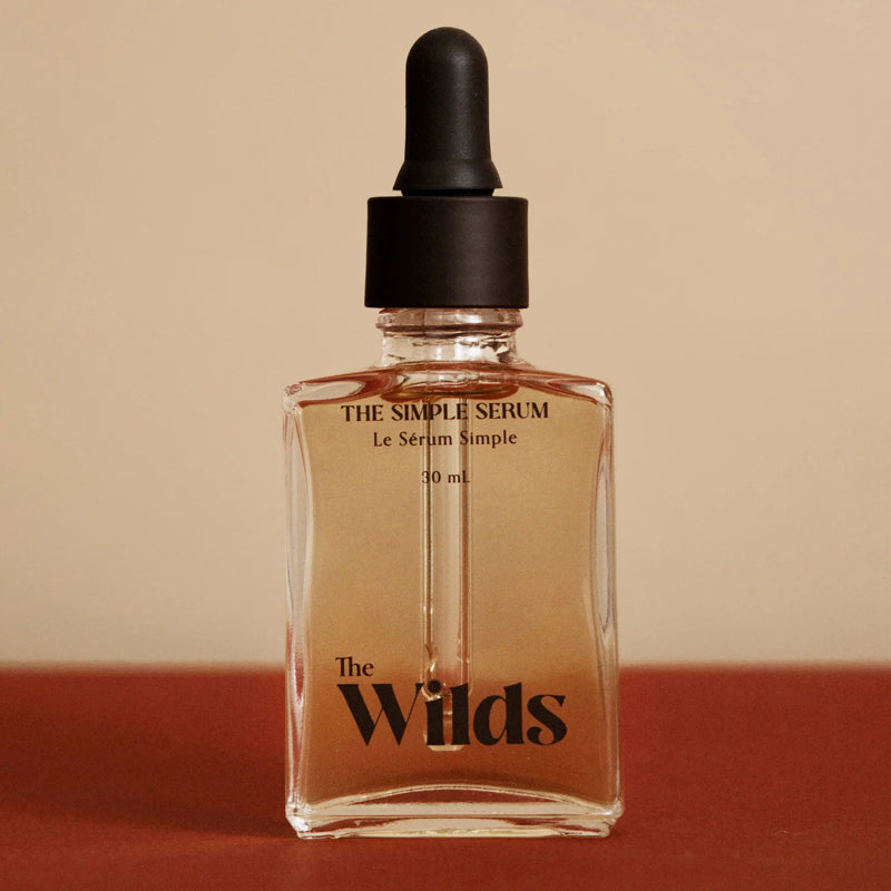 The Wilds The Simple Serum - Product shown on red background