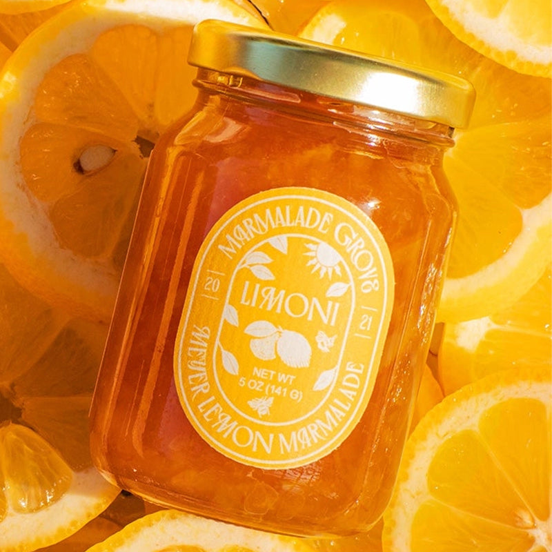 Marmalade Grove Meyer Lemon &amp; Honey Marmalade - Overhead shot of product on top of lemon slices