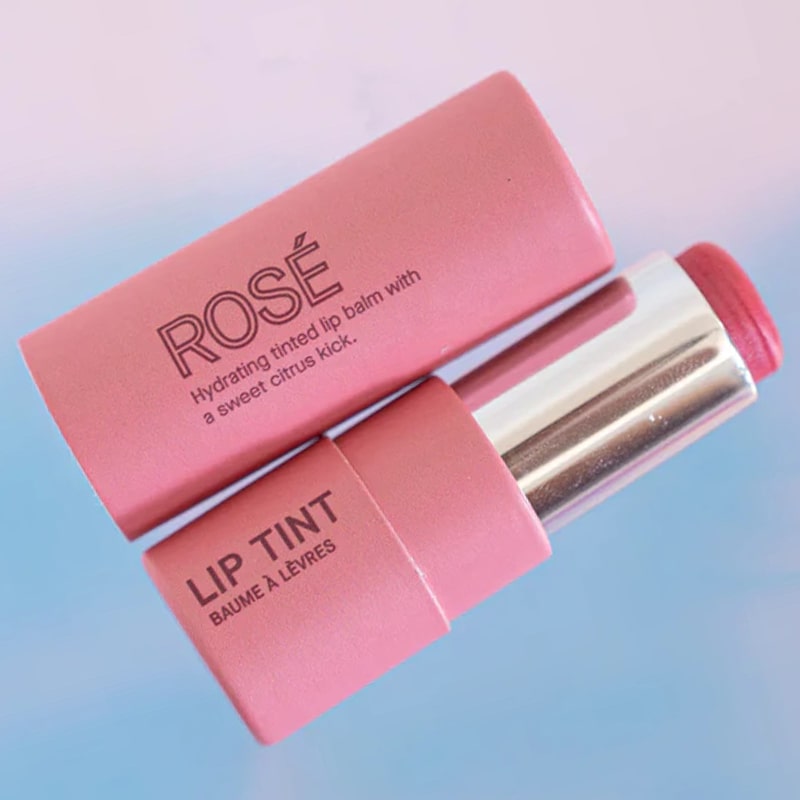 Pink House Organics Lip Tint - Rose - open lip balm tube next to cap lifestyle 