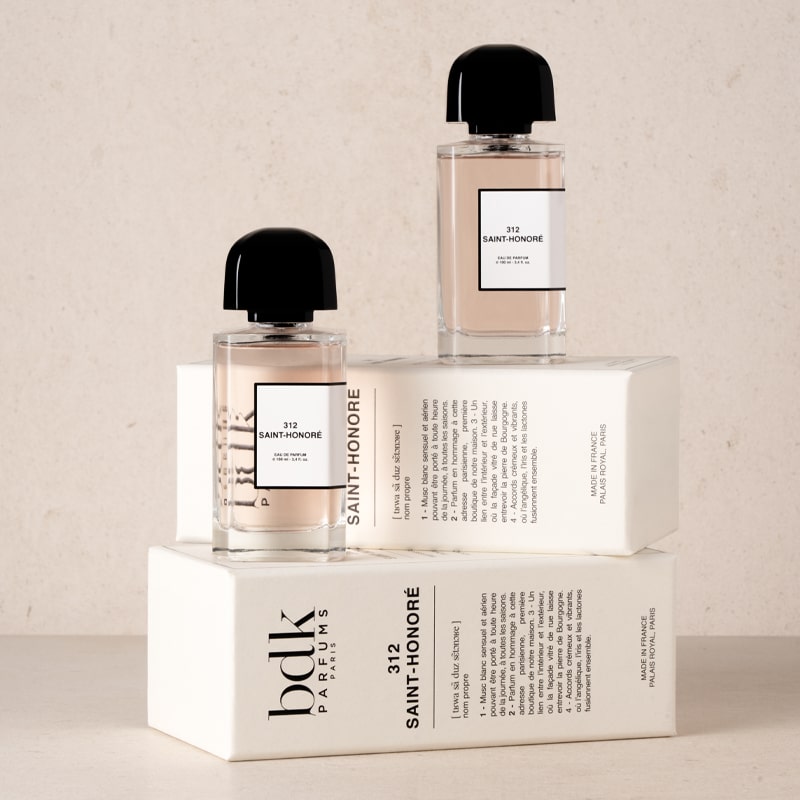 BDK Parfums 312 Saint-Honore Eau de Parfum - Perfume bottles stacked on top of packaging 