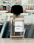 BDK Parfums 312 Saint-Honore Eau de Parfum - Bottle in front of photo of buildings