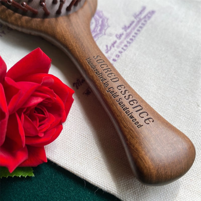 The Sacred Essence Angel Scalp Massage Brush - Closeup of product handle