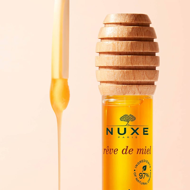 Nuxe Reve de Miel® Honey Lip Care - Closeup of product next to applicator