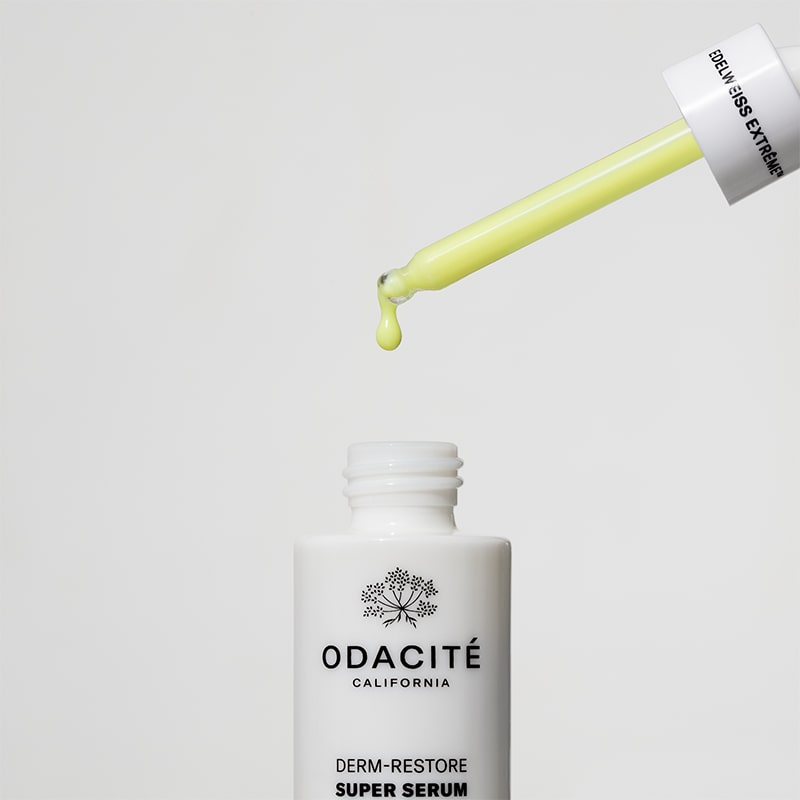 Odacite Edelweiss Extreme™ Derm-Restore Super Serum - dropper filled with serum dropping into bottle