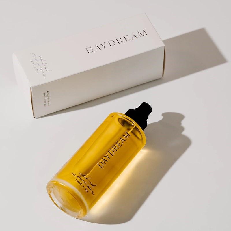 Orchid + Ash Daydream All-Natural Body Oil - Orange + Neroli - product shown next to packaging