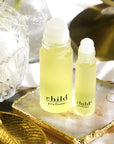 Child Perfume Roll On Lifestyle shot with both size bottles open
