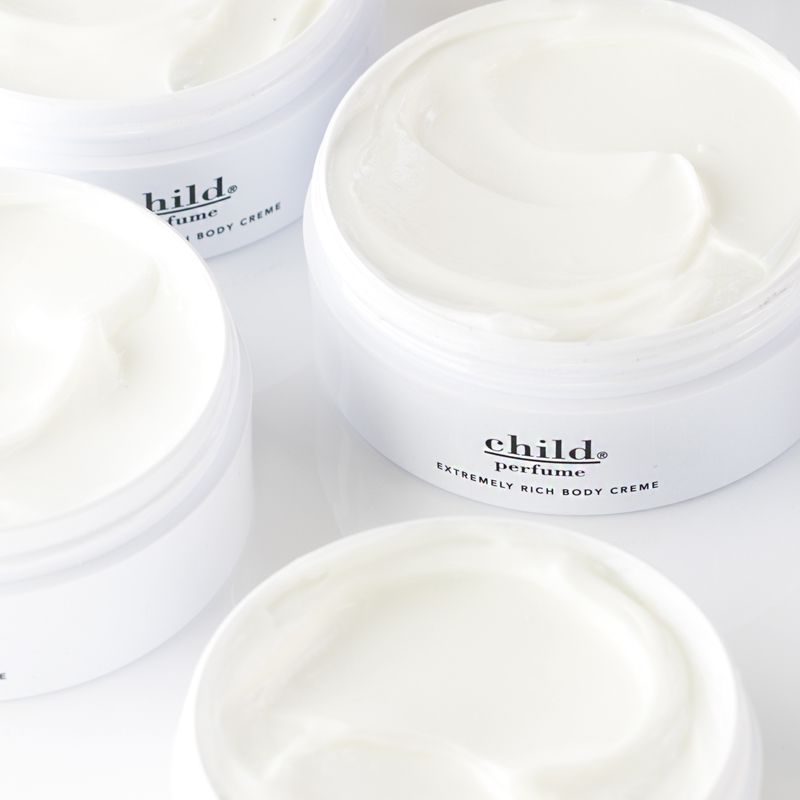 Child Extremely Rich Body Creme open jars