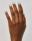 Model with dark skin tone wearing JINsoon Nail Lacquer - Peace