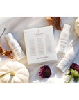 Innersense Organic Beauty Pure Travel Trio beauty shot with white pumpkins and flowers on a white cloth