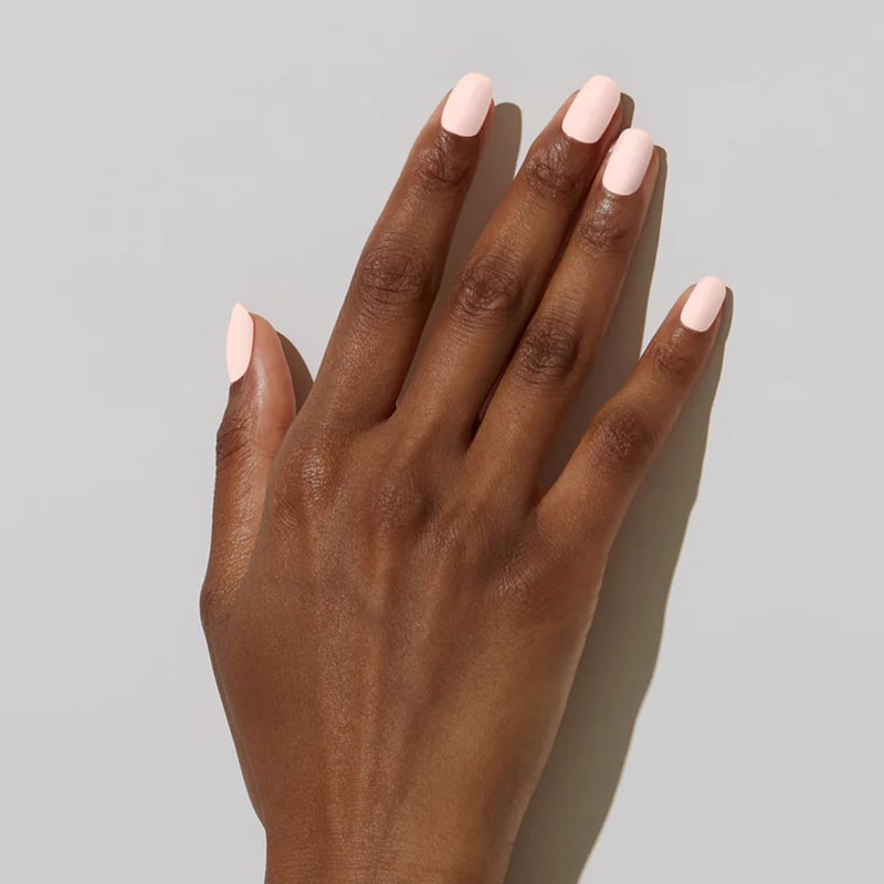 Model with dark skin tone wearing JINsoon Nail Lacquer - Pinky