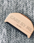 Care By Me Cashmere Comb on grey sweater