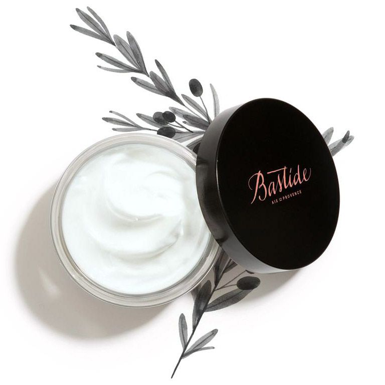 Bastide Corps A Corps Body Cream open jar with branches