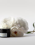 Penny Frances Apothecary Love Rosa A Rose Facial Balm Beauty shot with roses
