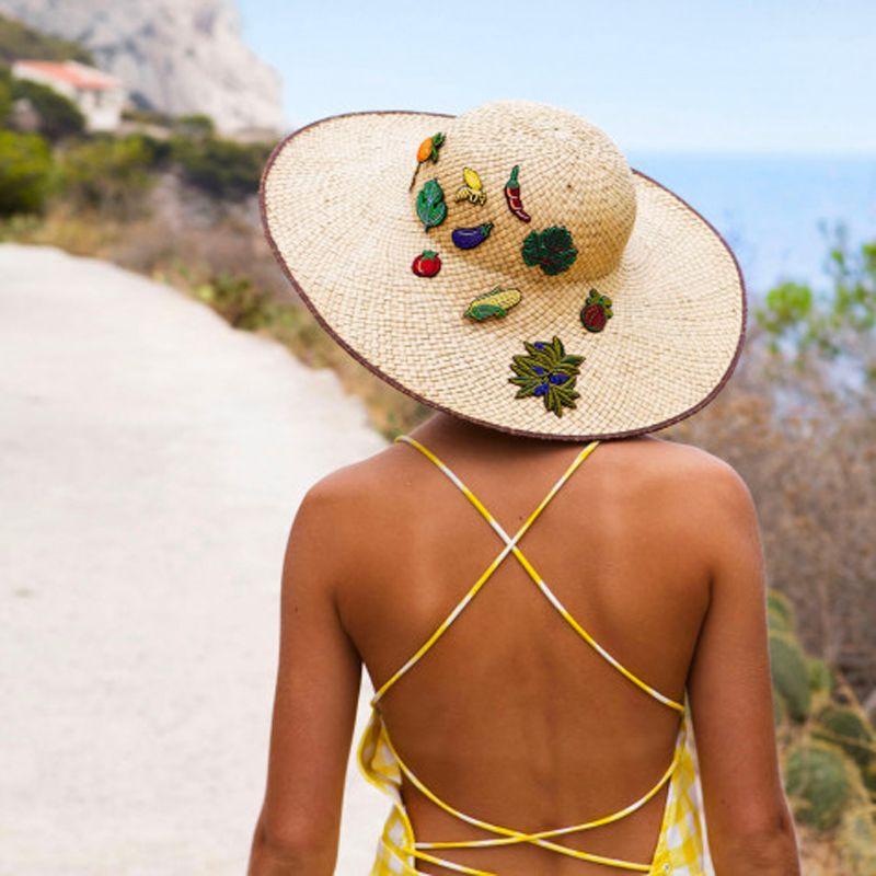 Macon &amp; Lesquoy Hand Embroidered Pins - showing pins on a woman&#39;s sun hat