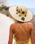 Macon & Lesquoy Hand Embroidered Pins - showing pins on a woman's sun hat