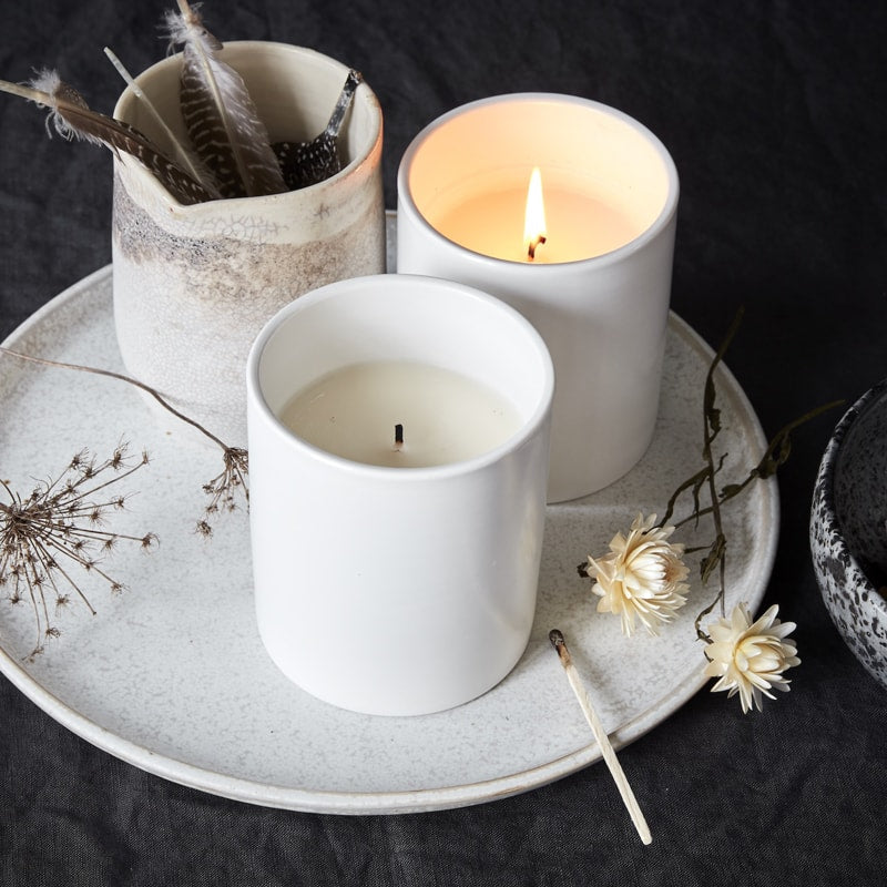 The Floral Society Juniper &amp; Geranium Candle lifestyle shot with other items (not included)