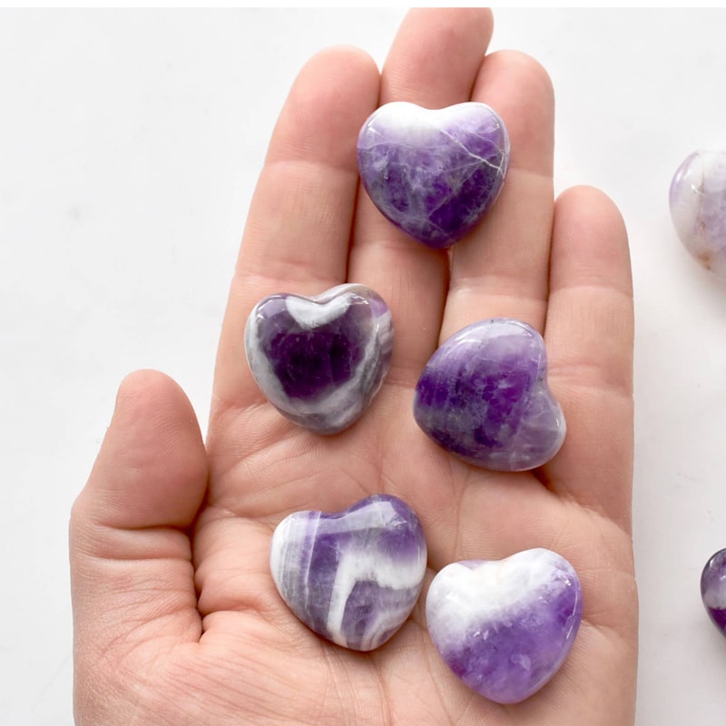 Open Heart Apothecary Amethyst Heart Crystal multiple stones shown in hand for size comparison