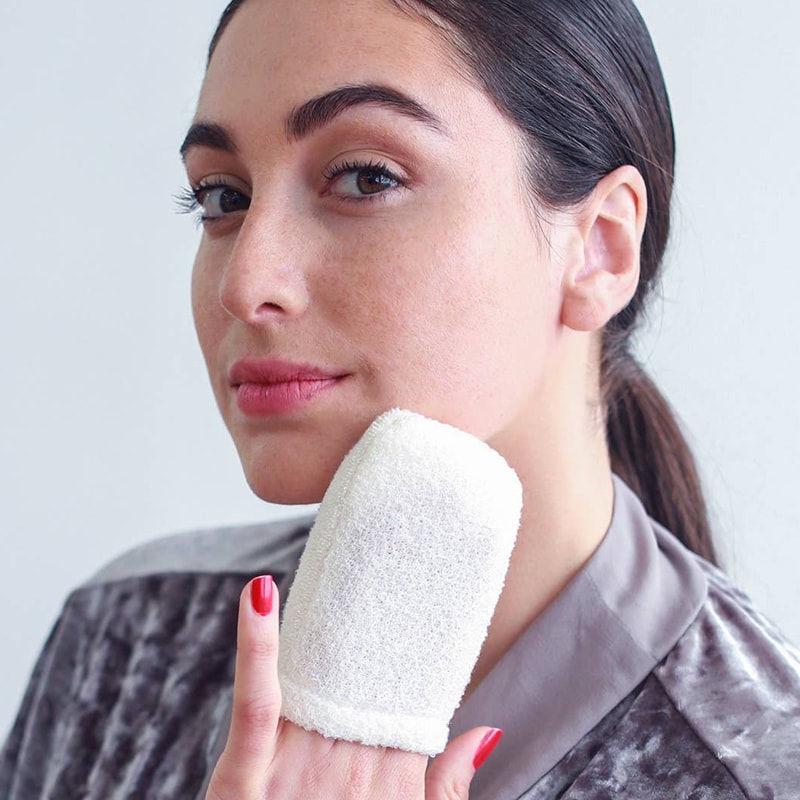 Daily Concepts Daily Facial Micro Scrubber on model&#39;s fingers