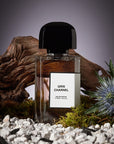 Beauty shot of BDK Parfums Gris Charnel Eau de Parfum in front of wood