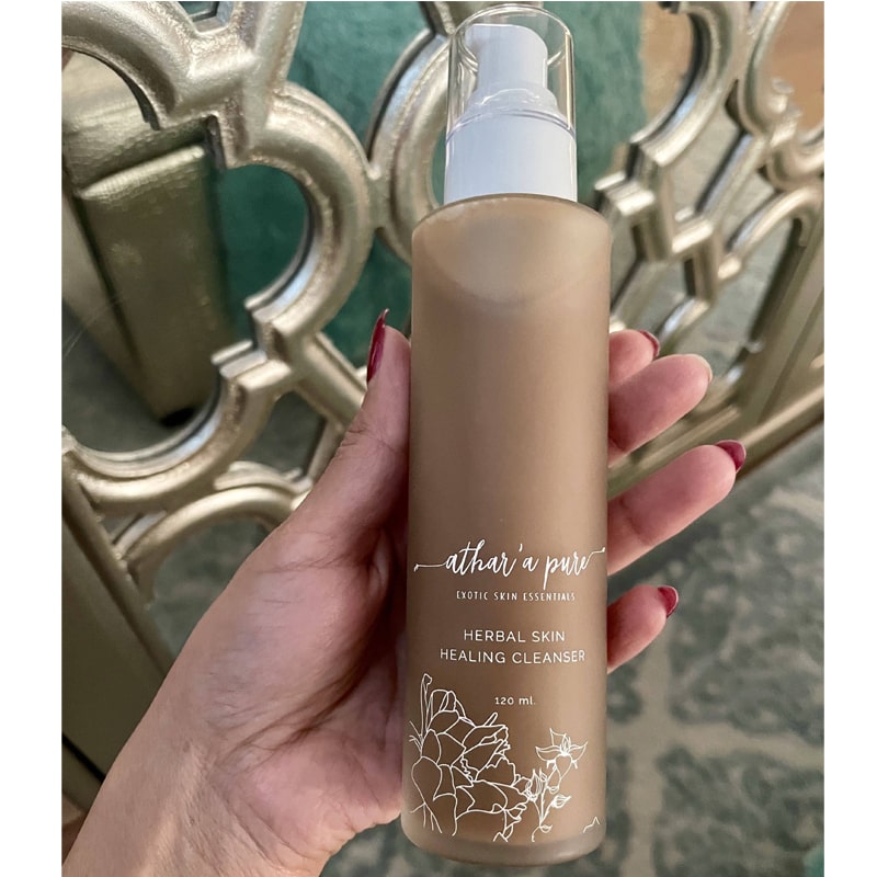 Athar’a Pure Herbal Skin Healing Cleanser beauty shot in model&#39;s hand