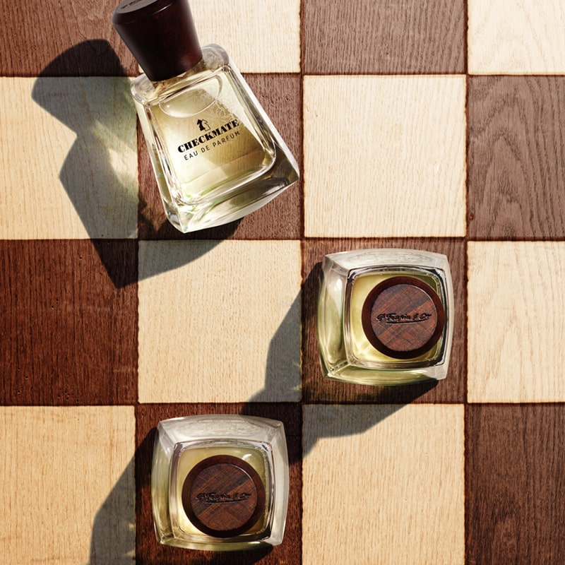Frapin Checkmate Eau de Parfum beauty shot showing bottles on a chess board (not included) bottles sold individually