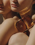 Gas Bijoux Summer 69 Eau de Parfum on shoulders of two women