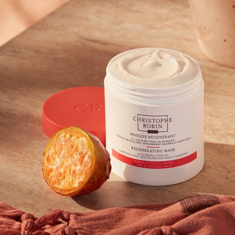 Christophe Robin Regenerating Mask with Rare Prickly Pear Seed Oil showing open jar on table with key ingredient