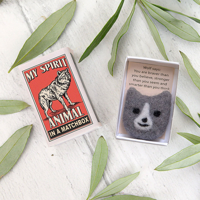 Marvling Bros Ltd My Spirit Animal Wool Felt Wolf In a Matchbox showing open box and lid with leaves in background