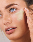 Odacite Green Smoothie Quenching Creme showing model applying to face