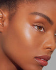 Roen Beauty Roglow Skin Stick Highlighter – Lit showing on model 