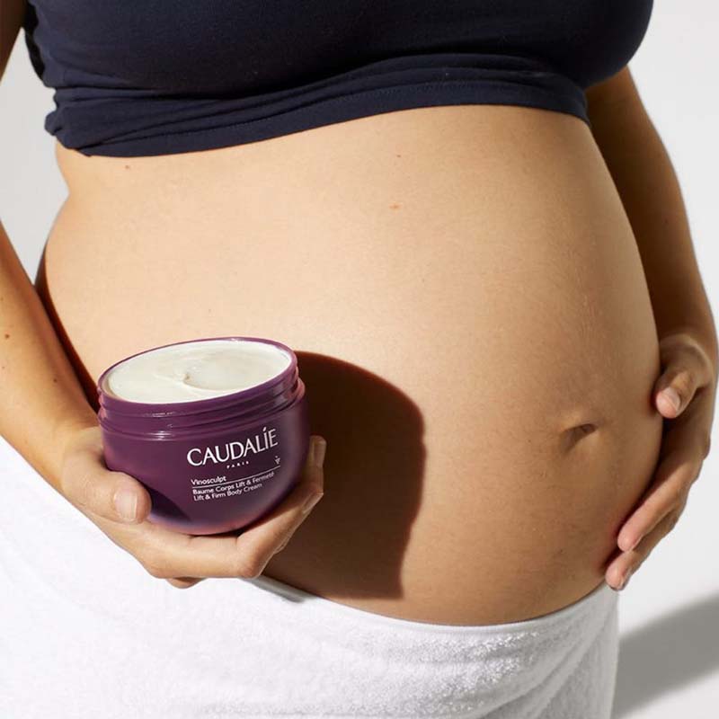 Caudalie Vinosculpt Lift & Firm Body Cream showing next to pregnant belly