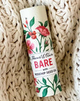 Stewart & Claire Bare Unscented Lip Balm with Rosehip Seed Oil showing on a knitted blanet