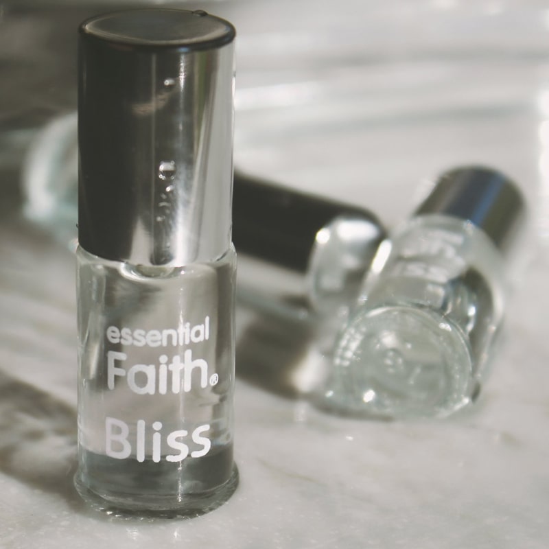 Essential Faith Bliss Roll-On showing 3 bottles with silver lids and white text