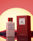 Eau d'Italie Mystic Sunset Eua de Parfum Spray showing bottle next to packaging in front of a sunset