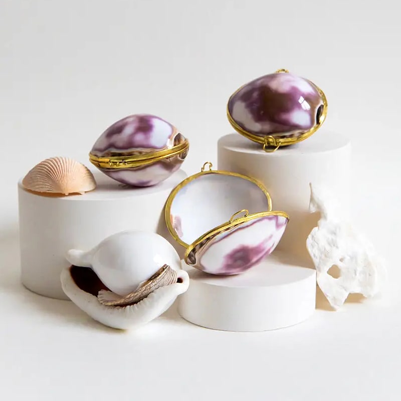 Earth Tu Face Lavender + Mint Lip Balm – Purple Cowry Shell showing multiple purple shells 