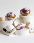Earth Tu Face Lavender + Mint Lip Balm – Purple Cowry Shell showing multiple purple shells 