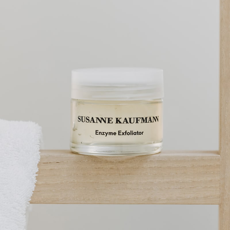 Susanne Kaufmann Enzyme Exfoliator - Product on shelf by towel.