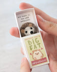 Marvling Bros Ltd Sending You A Hedgehug In A Matchbox showing matchbox open in model's hand for size perspective