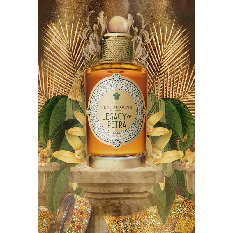 Penhaligon&#39;s Legacy of Petra Eau De Parfum - Beauty shot product shown on top of pillar, surrounded by plants