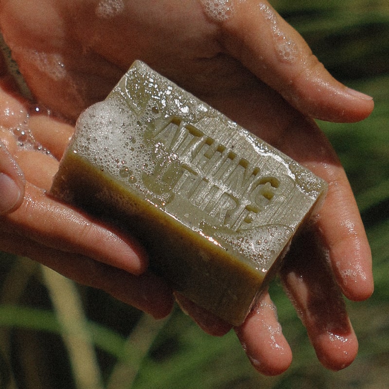 Bathing Culture Mind and Body Bar - Cathedral Grove (4.58 oz) - Product displayed in model&#39;s hands. 